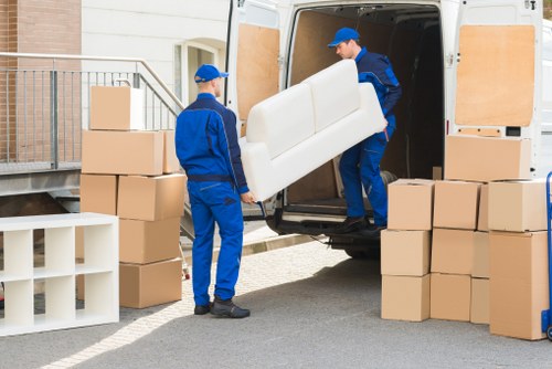 Removal team planning a move in a Roehampton residential street