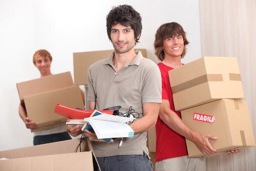 Professional movers handling residential furniture in Roehampton