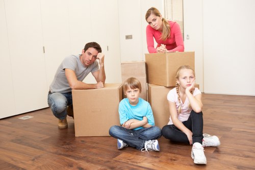 Packed boxes and furniture ready for a home move in Roehampton