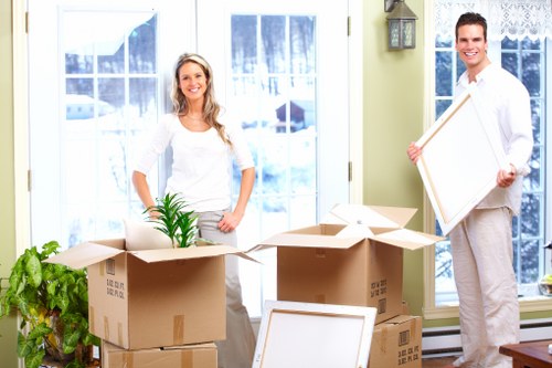 Removal team loading household furniture for a Roehampton move